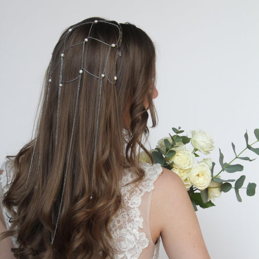 Silver headband with long chains cascading down the hair, intertwined to form a delicate pattern, adorned with natural pearls. Headband width 0.5 cm / 0.19 in, longest chains 56 cm / 22.04 in.
